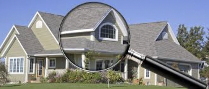 Residential home with a magnifying glass 